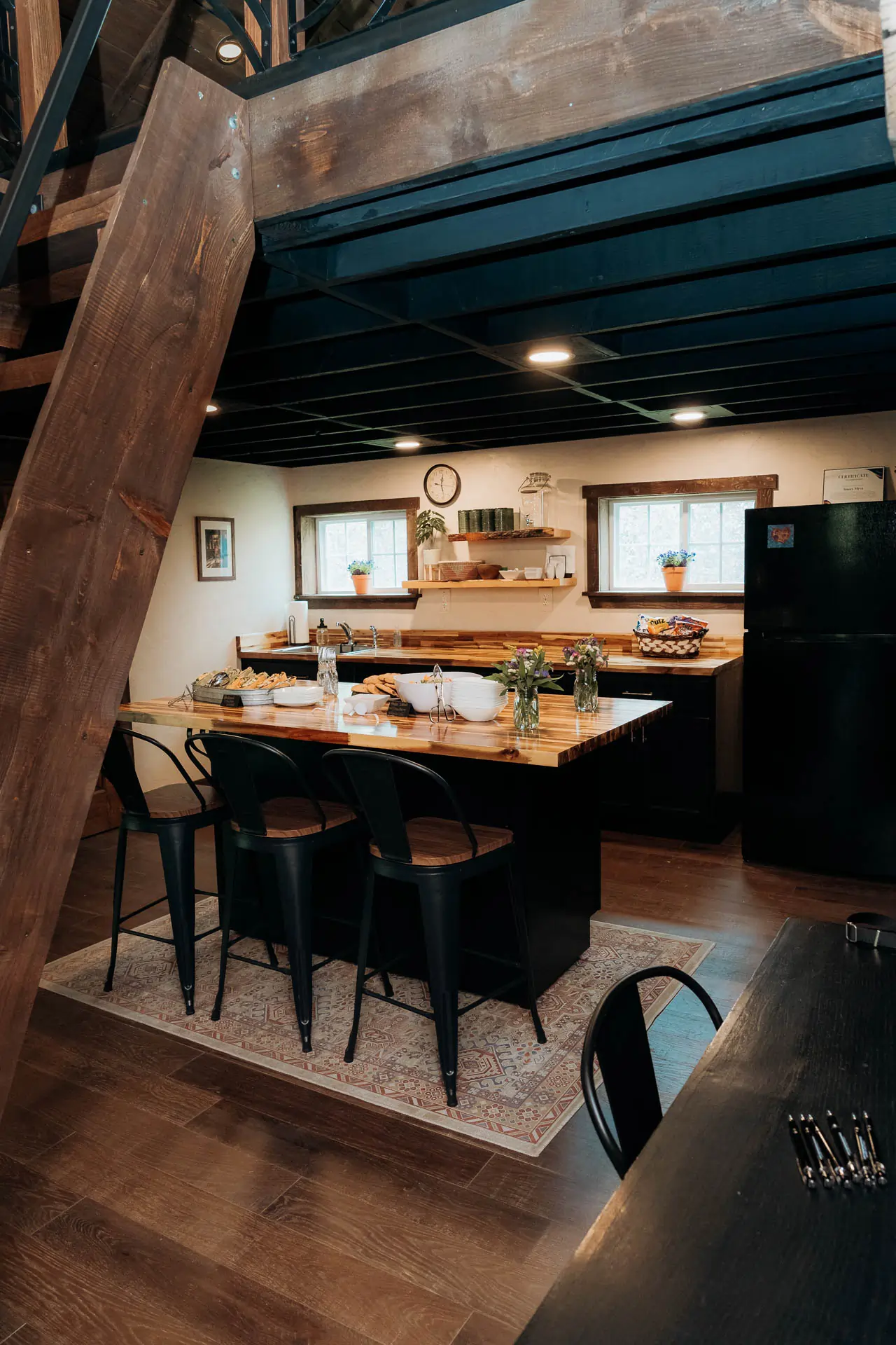 The renovated barn kitchen with butcher-block island and bar seating